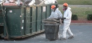 Technicians Removing Burned Debris From A Commercial Property